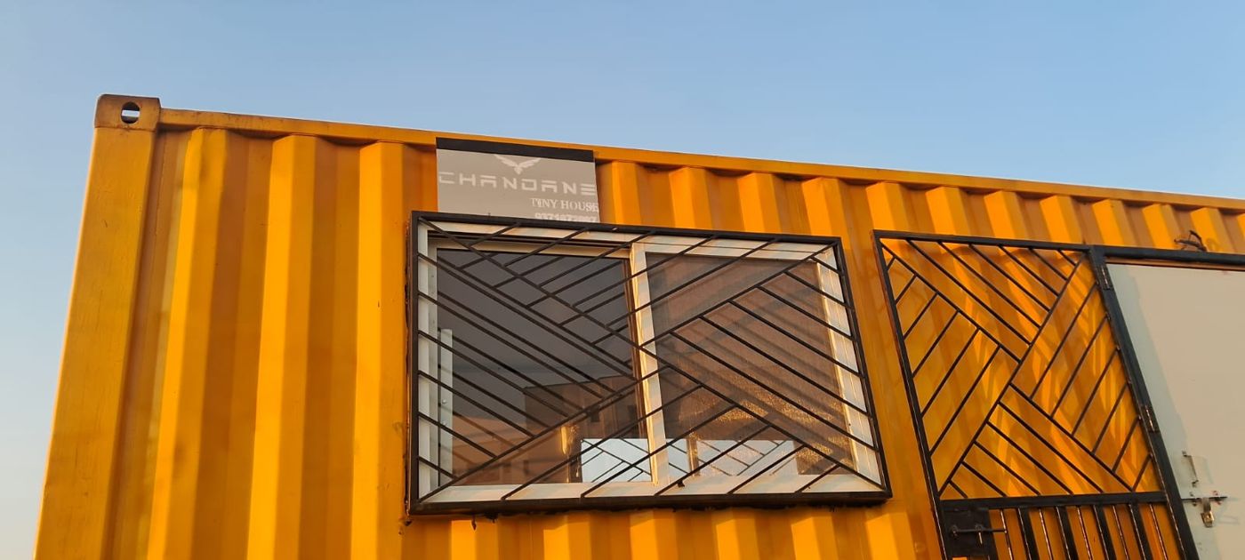 Yellow Chandane container with diagonal-grille window